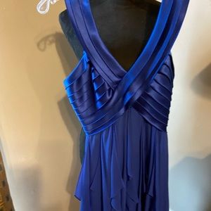 This is a BCBG  A beautiful dark blue to the knee well fitting dress